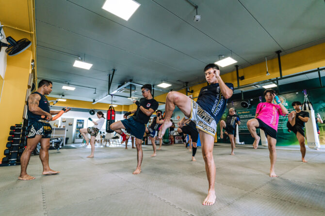 trainees learning muay thai kicks